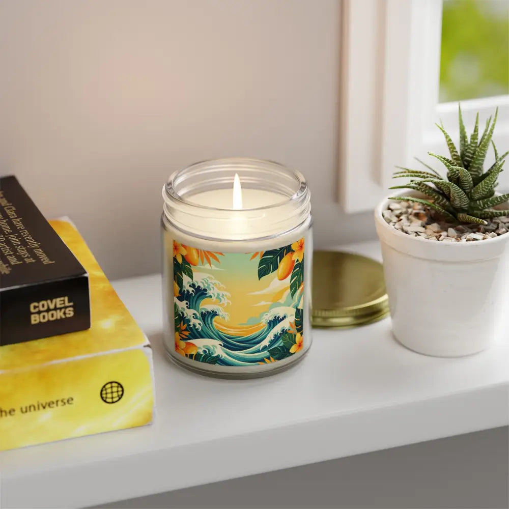 Lit candle with ocean wave design in Tropical Scented Candle Mango Coconut Escape jar