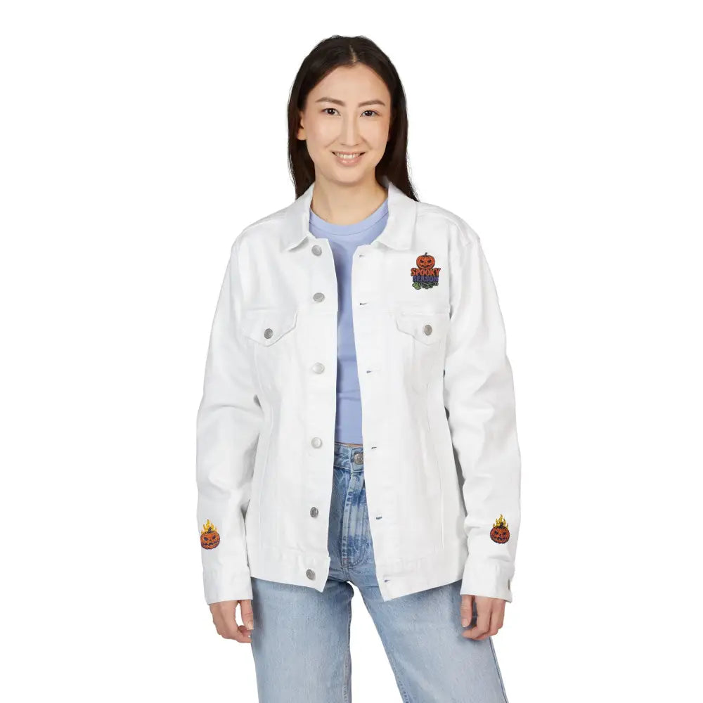 Woman wearing white denim jacket with pumpkin patches for spooky season streetwear