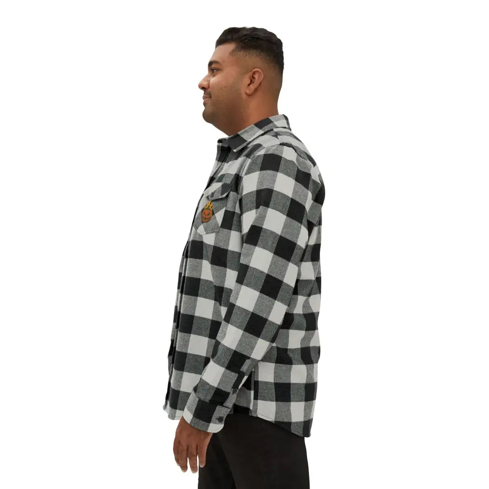 Men’s black and white checkered flannel shirt with flaming pumpkin design from trading company exp50f