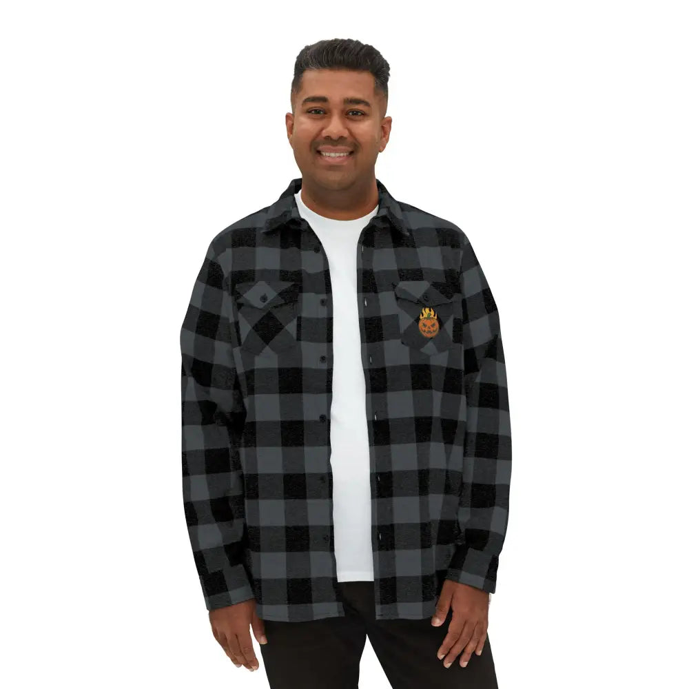 Men’s gray and black plaid flannel shirt with flaming pumpkin emblem, perfect for Halloween by Trading Company EXP50F