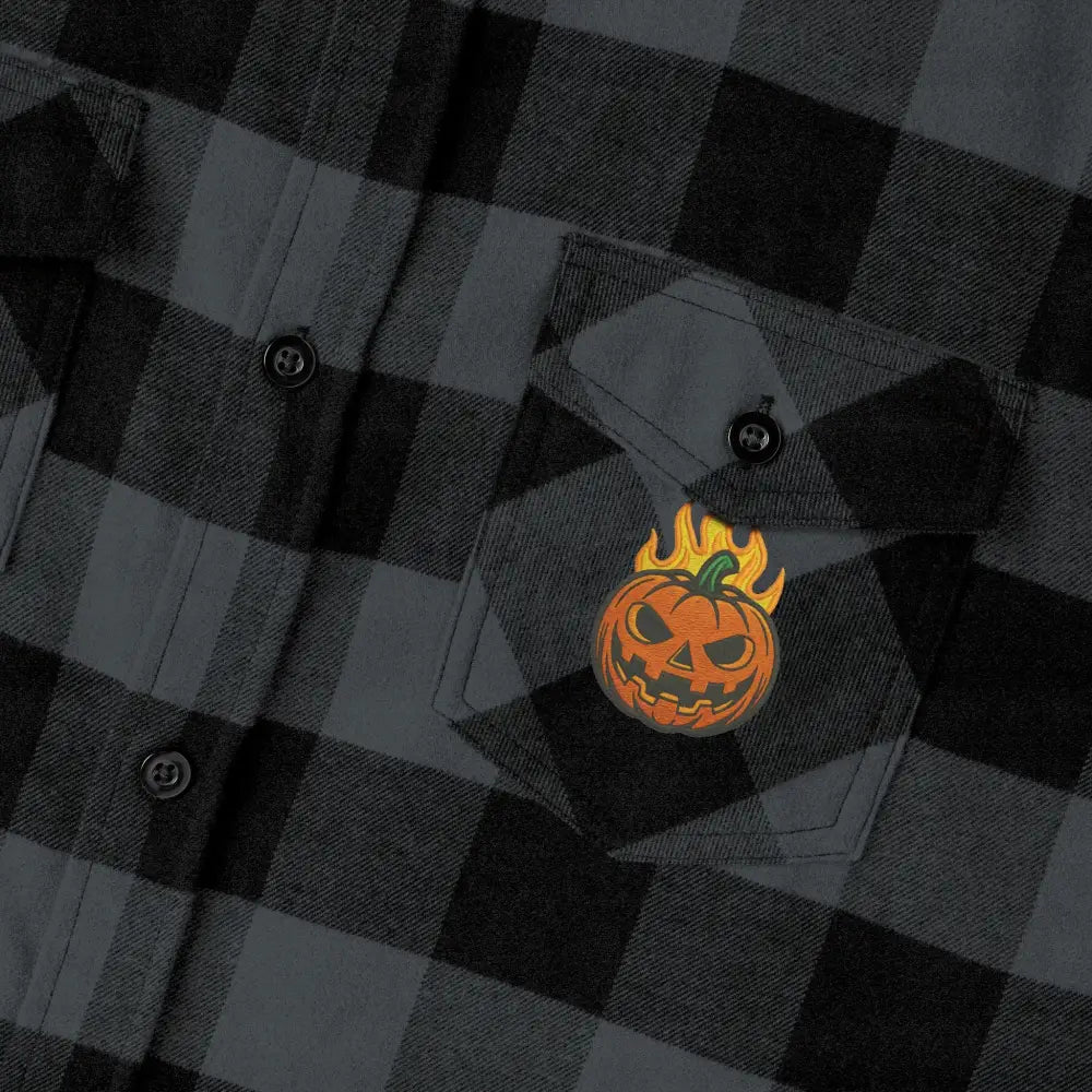 Dark gray and black plaid flannel shirt with flaming pumpkin patch, perfect for Halloween