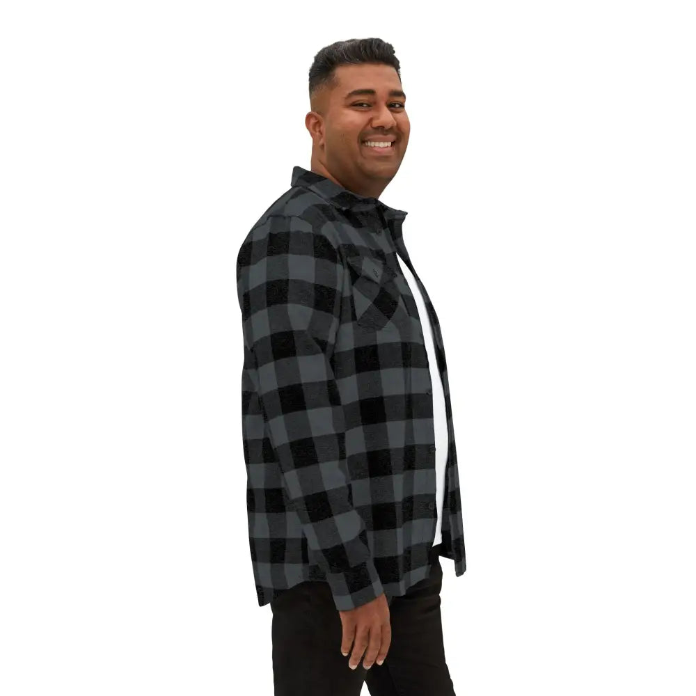 Unisex flaming pumpkin flannel shirt worn over white tee and dark pants by man