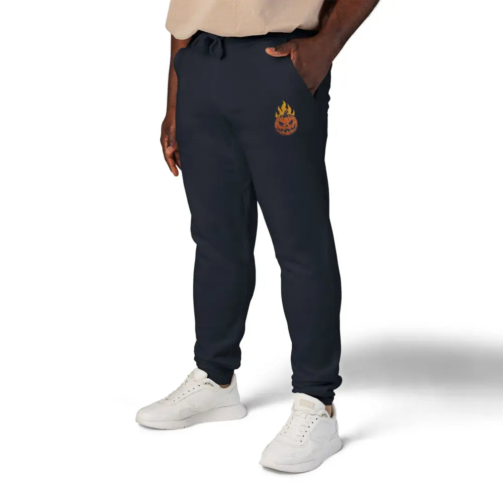 Men’s black fleece sweatpants with flaming pumpkin emblem for cozy Halloween streetwear