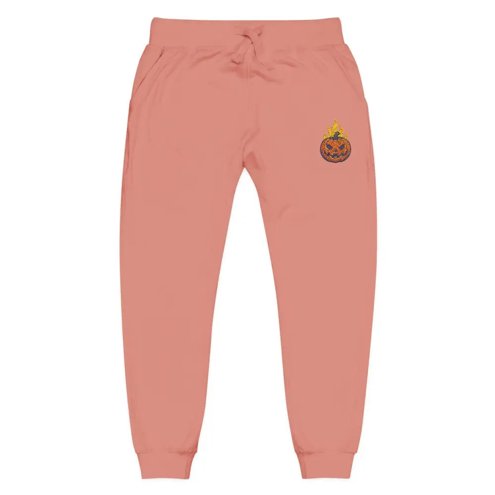 Pink fleece sweatpants with flaming pumpkin design on right thigh for cozy Halloween style