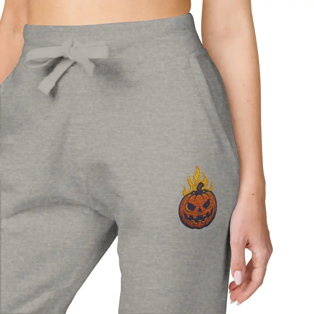 Gray fleece sweatpants with flaming pumpkin design for cozy Halloween streetwear