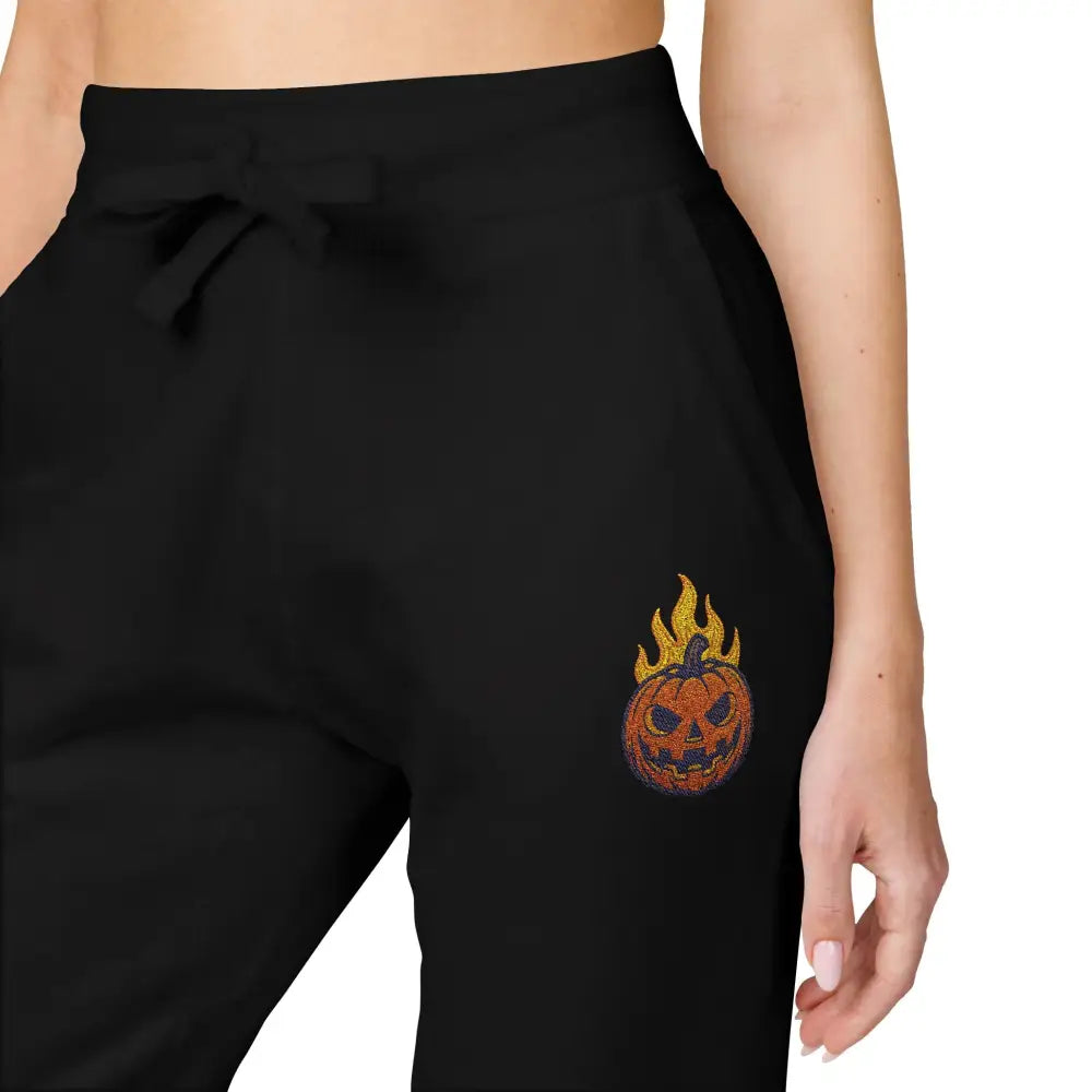 Unisex fleece sweatpants with flaming pumpkin graphic on right hip for cozy Halloween style