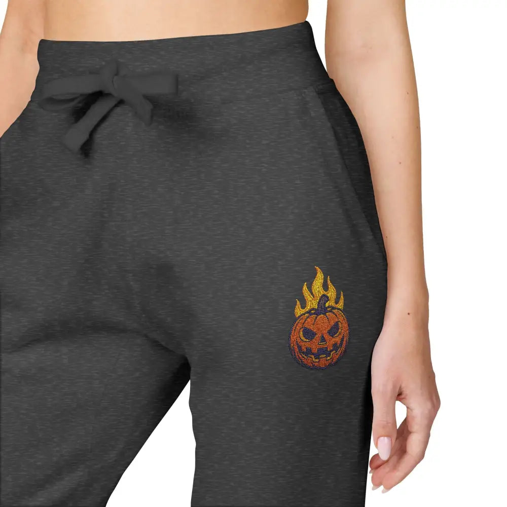 Dark gray fleece sweatpants with flaming pumpkin design for cozy Halloween streetwear
