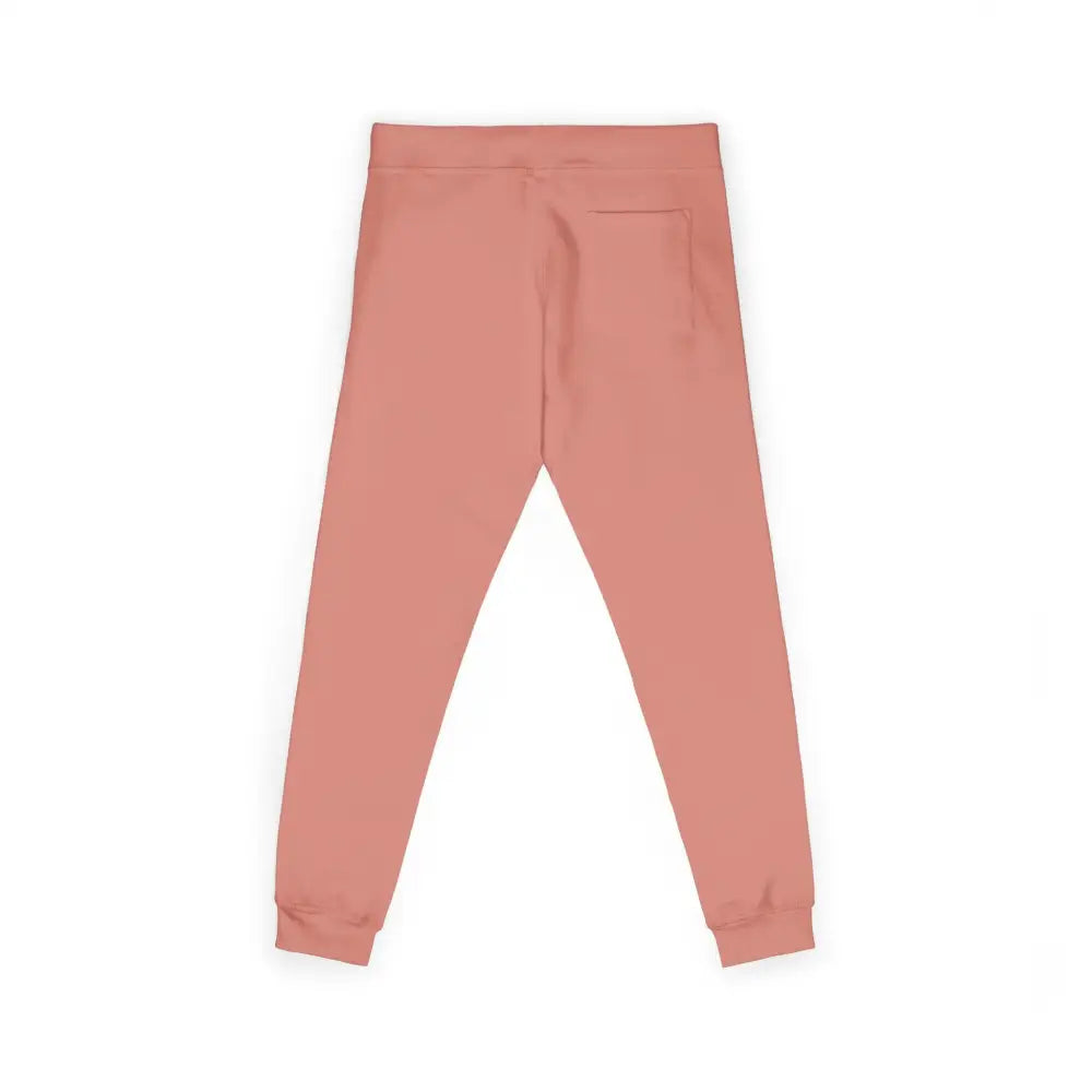Back view of salmon-colored fleece sweatpants with elastic waistband and cuffs featuring flaming pumpkin design