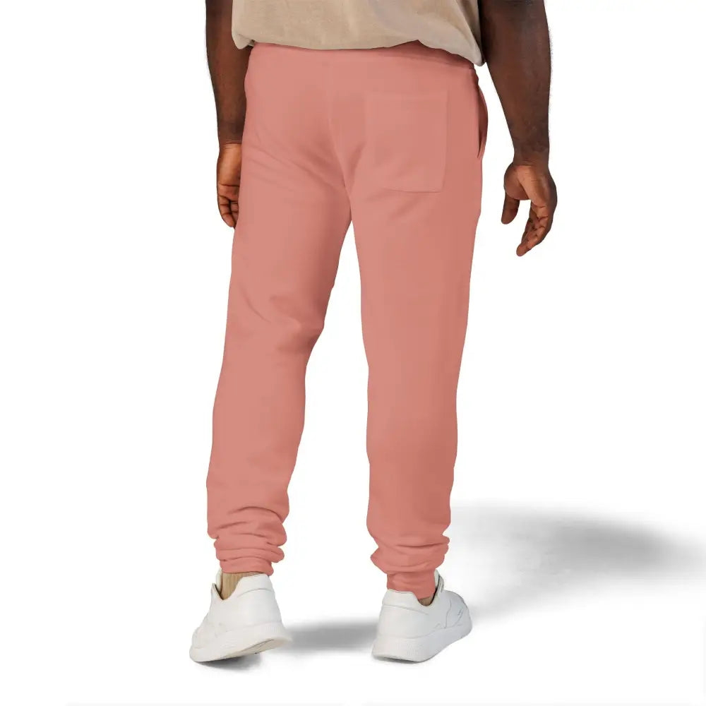 Men’s loose-fitting fleece sweatpants in flaming pumpkin color with cuffed ankles