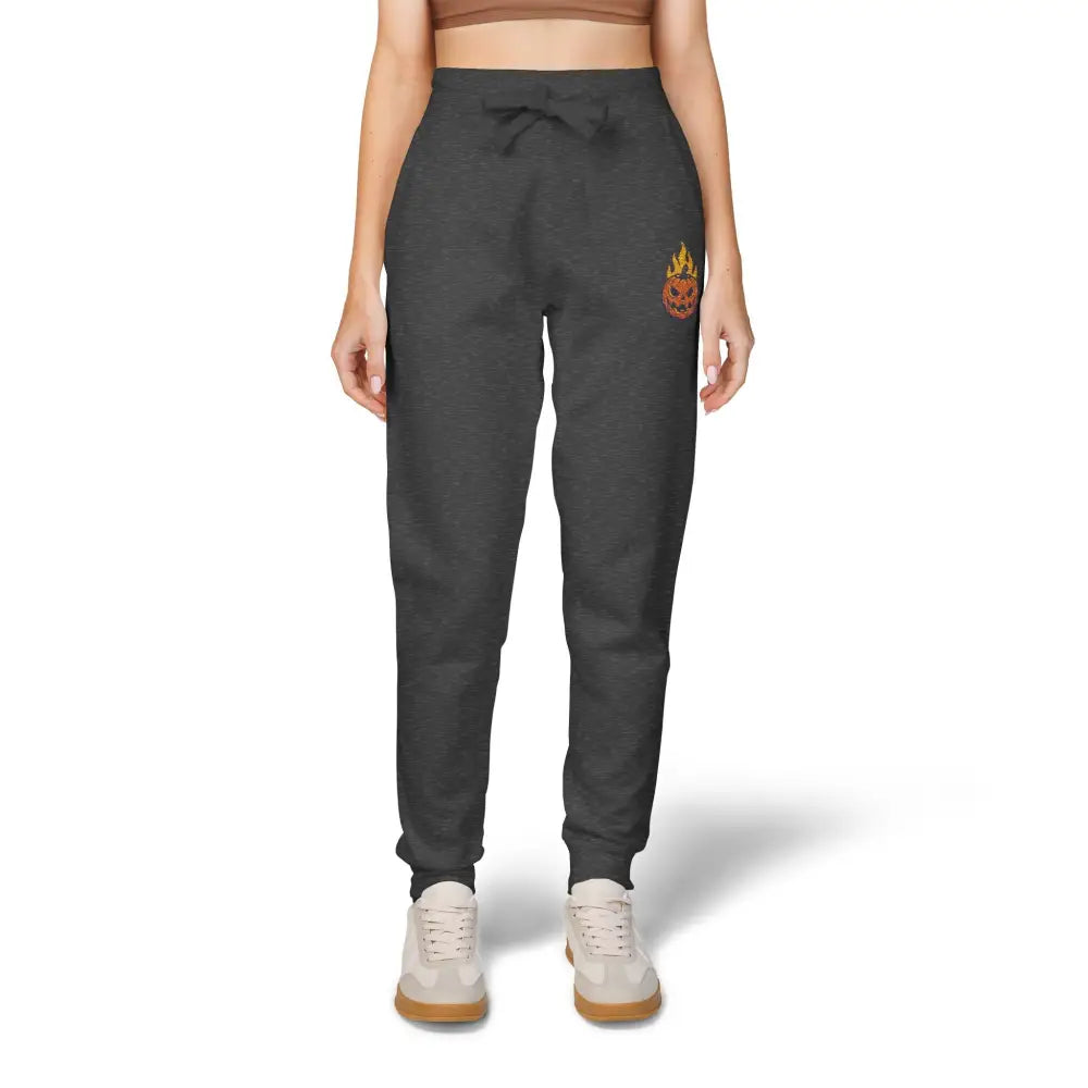 Women’s dark grey fleece sweatpants with flaming pumpkin graphic on right thigh for cozy Halloween style