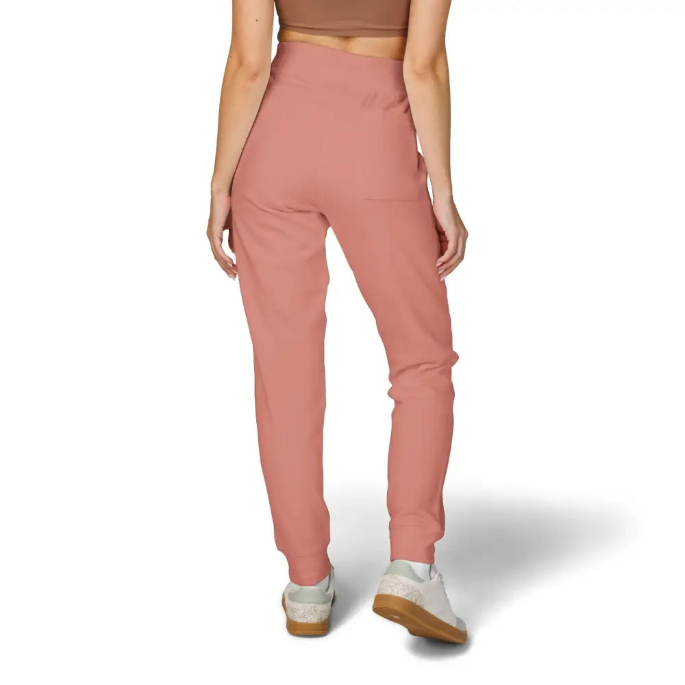 Women’s dusty rose fleece sweatpants with white sneakers from Flaming Pumpkin streetwear