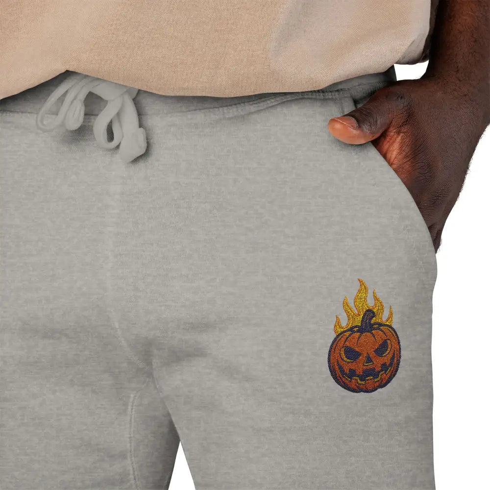 Light grey fleece sweatpants with flaming pumpkin graphic for cozy Halloween streetwear