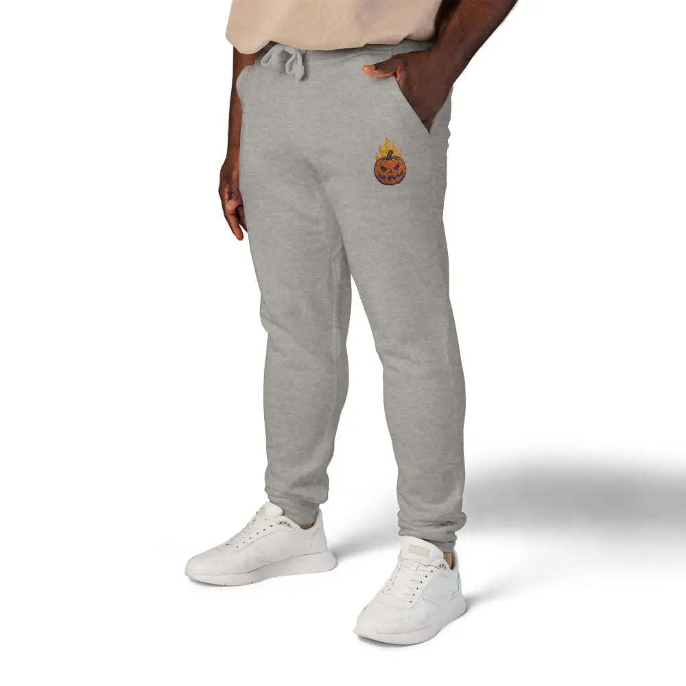 Gray fleece sweatpants with flaming pumpkin graphic for cozy Halloween streetwear