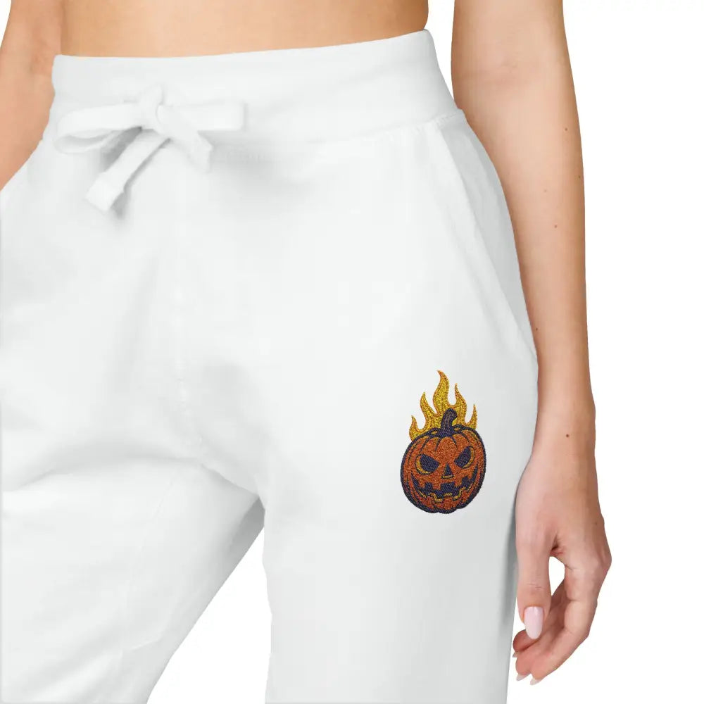 White fleece sweatpants with flaming pumpkin design for cozy Halloween streetwear