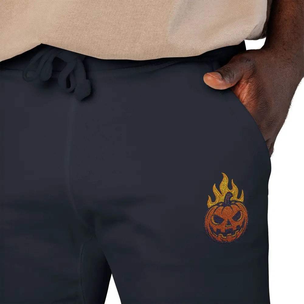 Dark blue fleece sweatpants with flaming pumpkin design for cozy Halloween streetwear