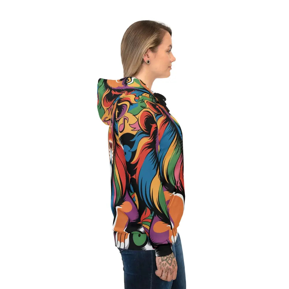 Woman wearing vibrant colorful long-sleeved hoodie with abstract patterns and musical notes in Groove King Roars by Honson Ventures Limited