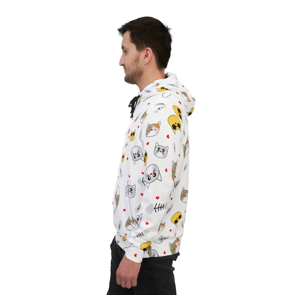 Man wearing a white cat-patterned unisex hoodie from PixiOnyx Meowcore Drop
