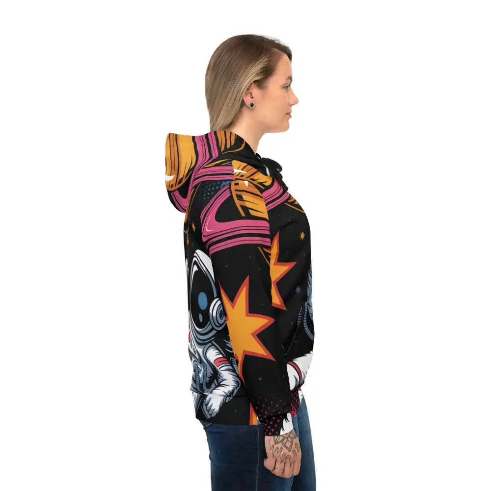 Woman in black hoodie with vibrant Saturn Balloon space graphic showcasing surreal skies meet streetwear