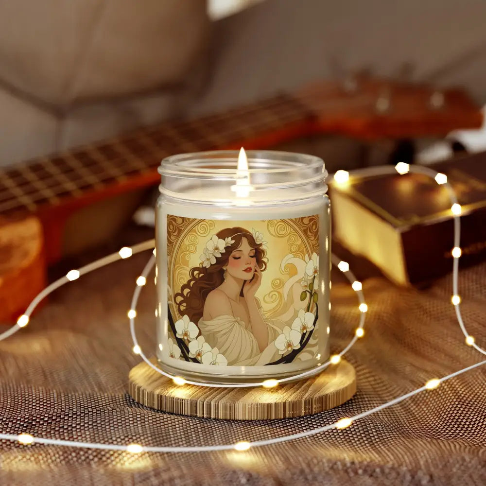 Lit vanilla bean scented candle with woman and flower label for PixiOnyx Aromatherapy