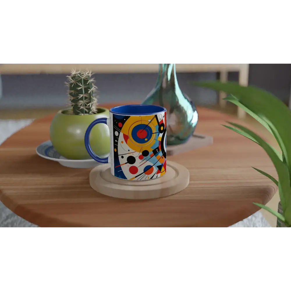 Blue-handled ceramic mug with abstract colorful artwork inside for the Dynamic Balance PixiOnyx brew