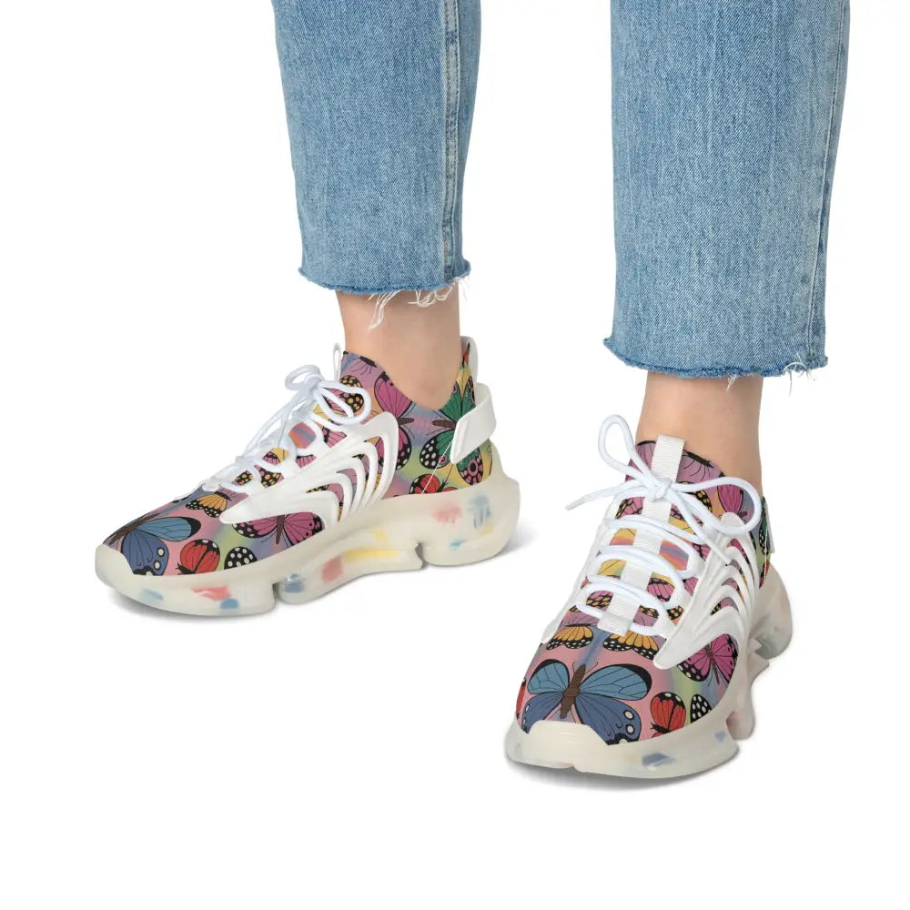White chunky sneakers with colorful butterfly and ladybug patterns from Kaleidoscope Flight by PixiOnyx Vibrant Athletic
