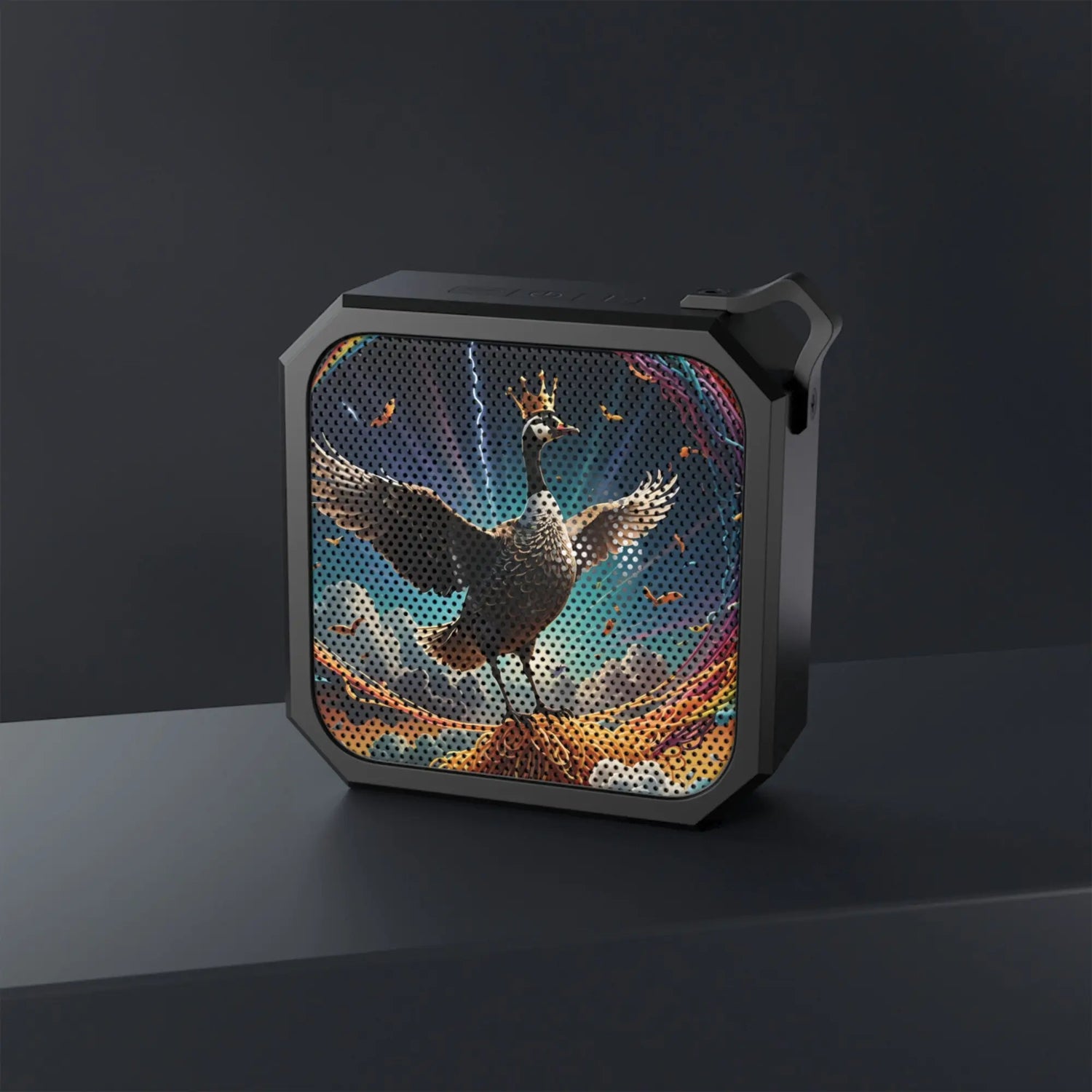 Black Bluetooth speaker featuring a sleek swan graphic design