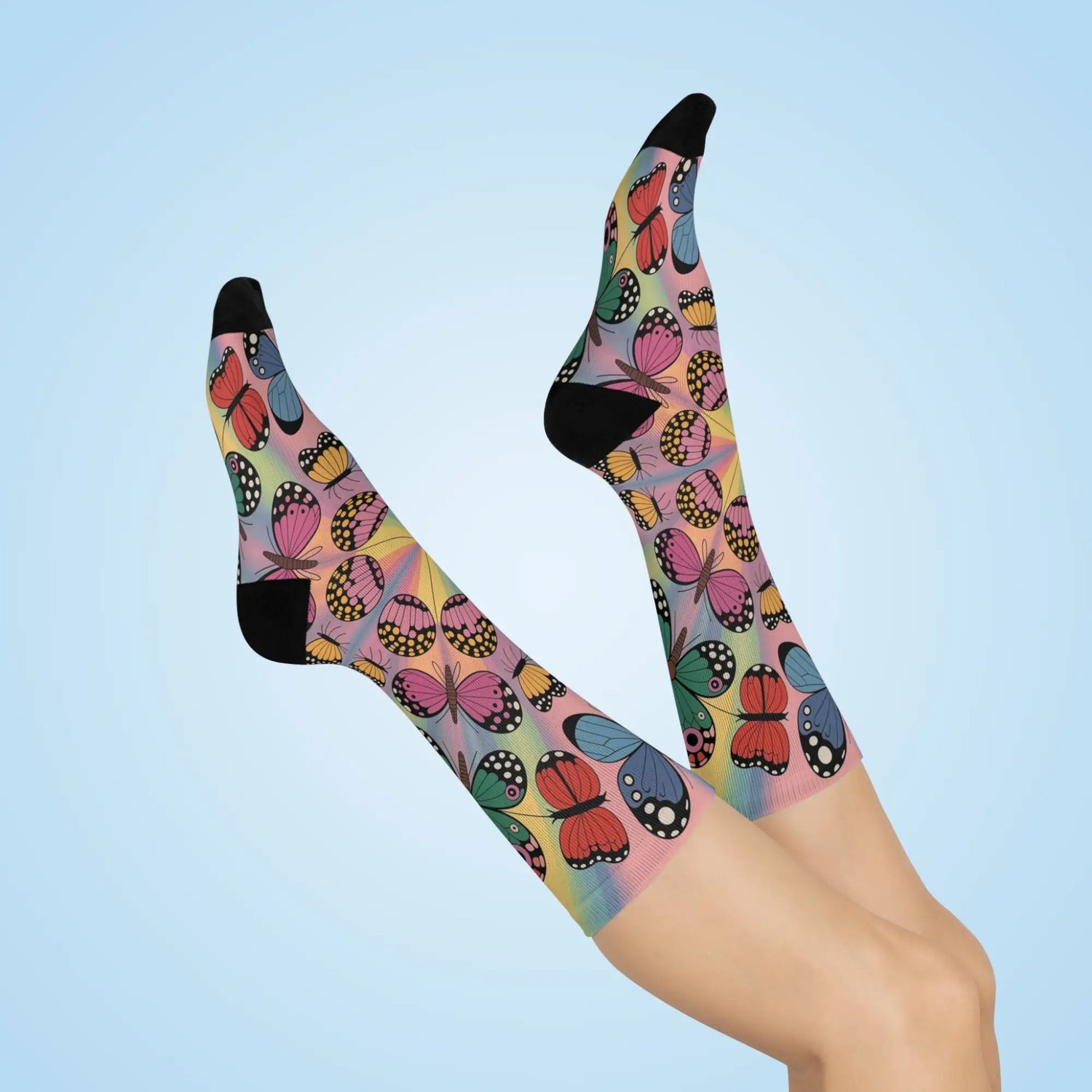Pair of knee-high socks with colorful butterfly pattern on pastel rainbow background in Socks – Comfort Meets Art collection