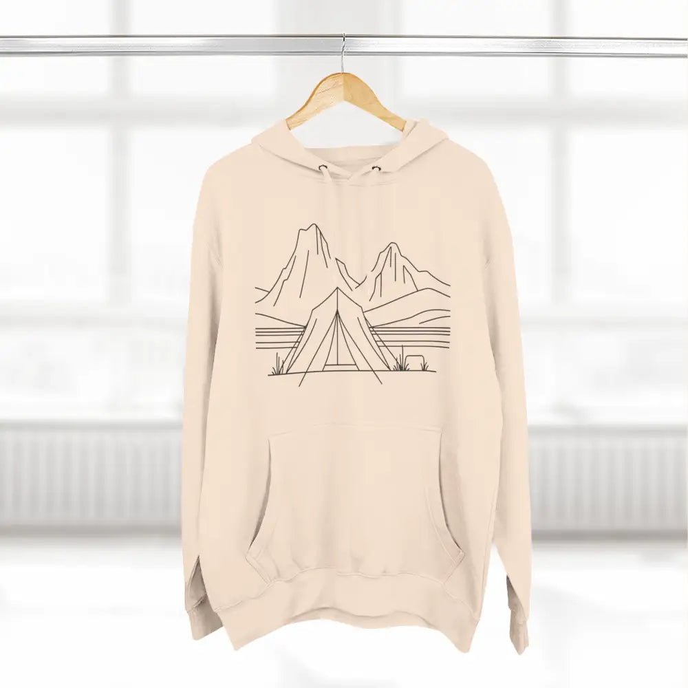 Light beige unisex hoodie with mountain lake tent line-art design and spacious kangaroo pocket