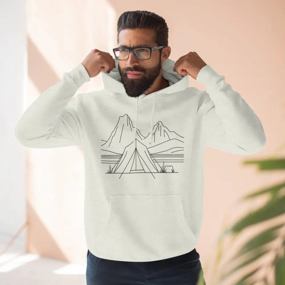 Light-colored unisex hoodie with mountain and tent graphic, cozy fleece, spacious kangaroo pocket
