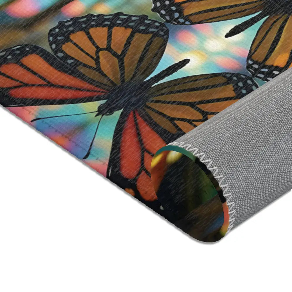 Butterfly-patterned area rug from PixiOnyx Kaleidoscopic Floor Art collection