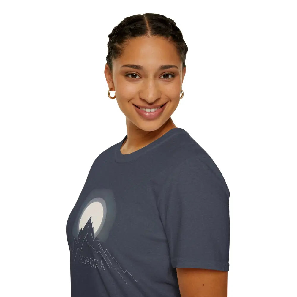 Woman wearing Aurora Mountain Unisex Softstyle T-Shirt with mountain and moon design, ribbed knit collar, shoulder tape stabilizes, reduces fabric waste