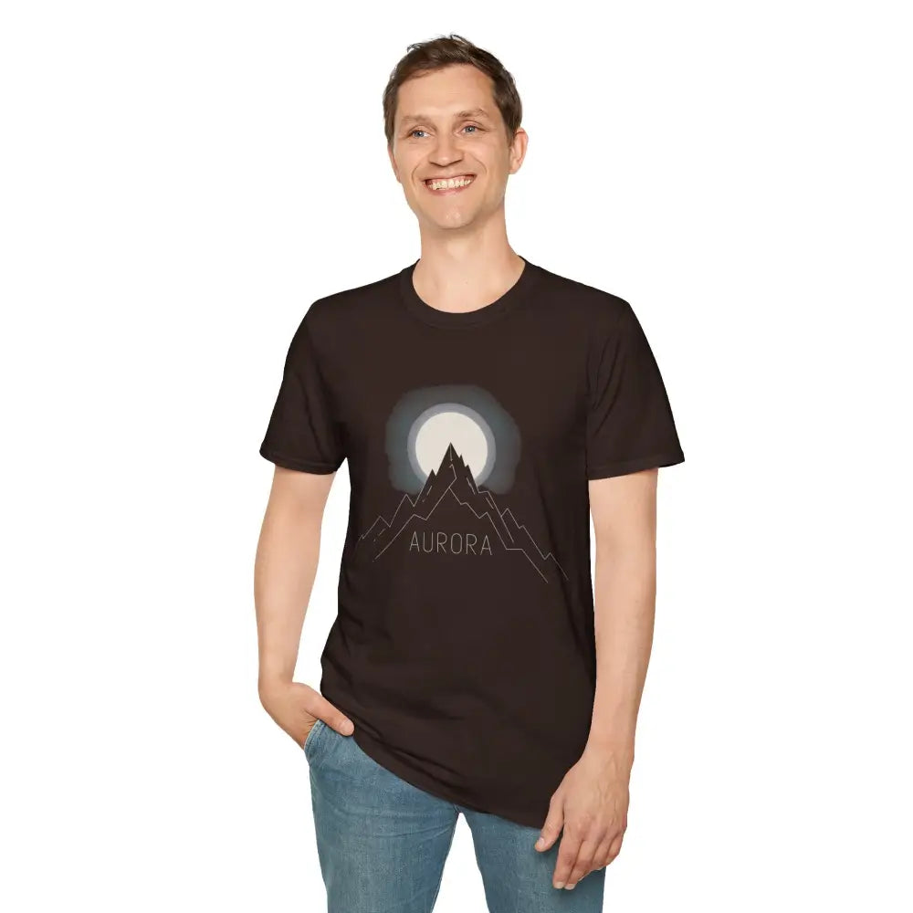 Smiling man in Aurora Mountain Unisex Softstyle T-Shirt with mountain and moon graphic