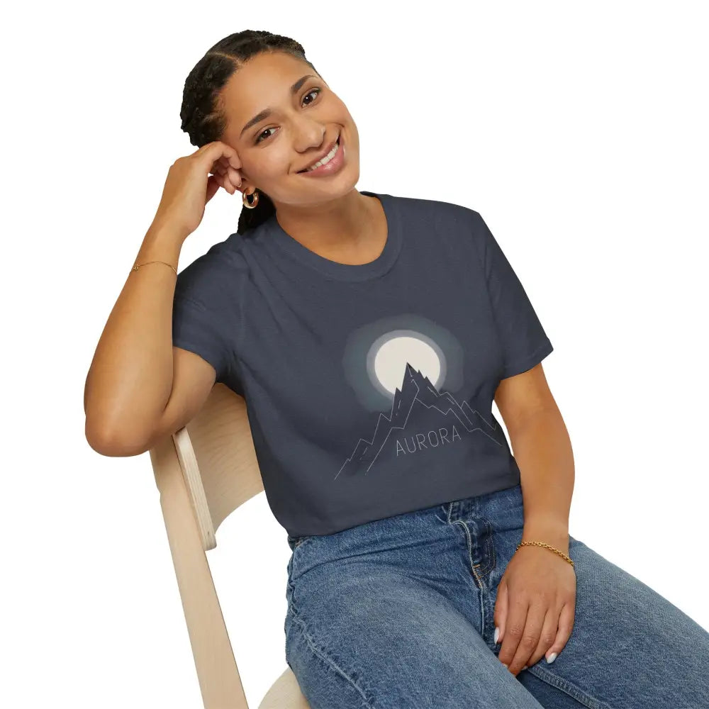 Woman wearing Aurora Mountain Unisex Softstyle T-Shirt with mountain and moon design, ribbed knit collar