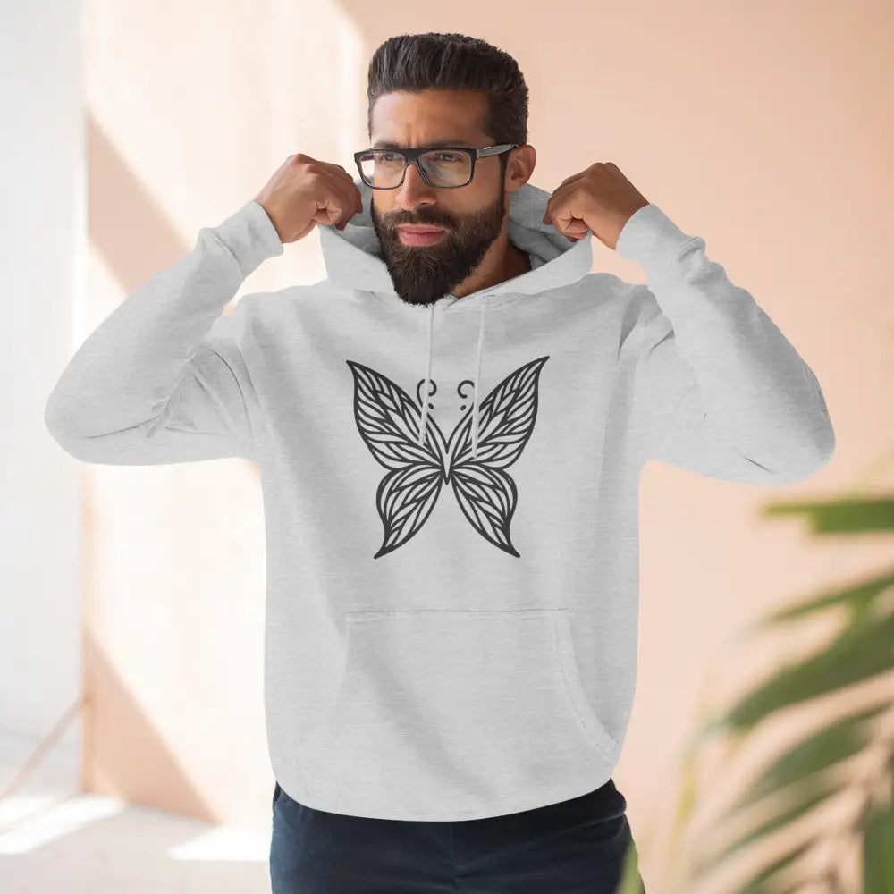Man in white fleece hoodie with black butterfly design, perfect for fall casual wear