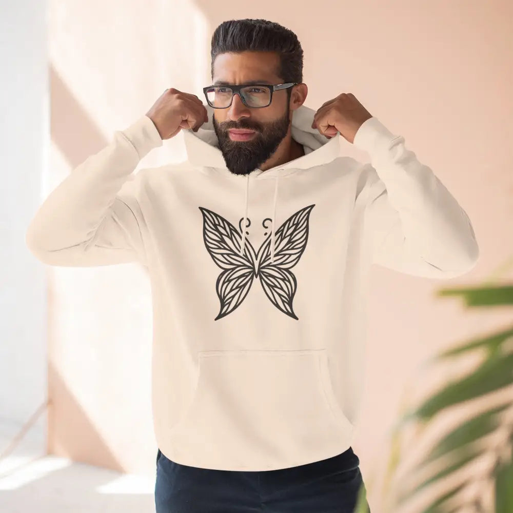 Man wearing a light-colored fleece hoodie with butterfly design, perfect for fall fashion and casual wear