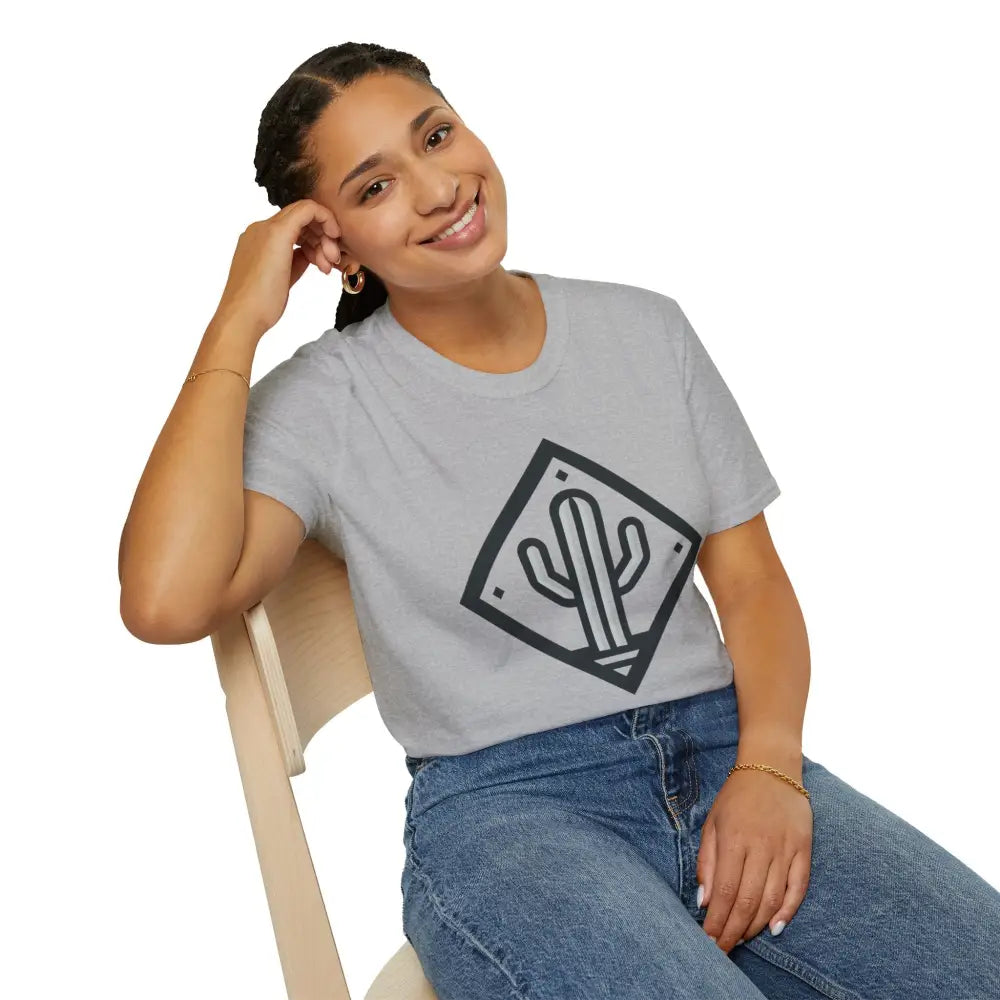 Smiling woman in light gray T-shirt and blue jeans showcasing Cactus Adventure eco-friendly travel tee with ultimate comfort and ring-spun cotton