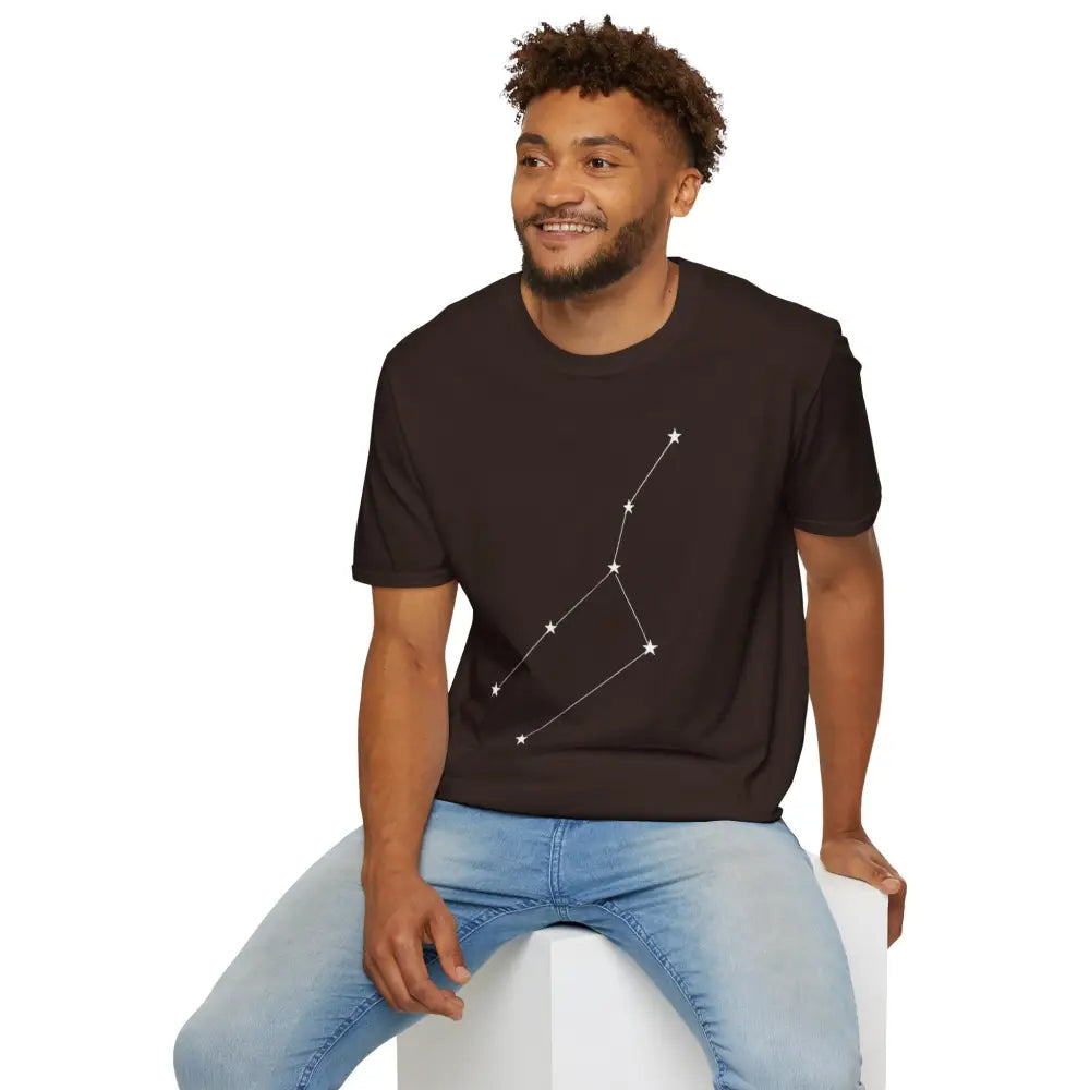Man wearing dark brown unisex softstyle T-shirt with white constellation graphic, cosmic vibe