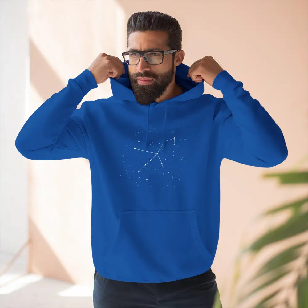 Man wearing a celestial constellation design cozy fleece hoodie with adjustable hood and spacious kangaroo pocket