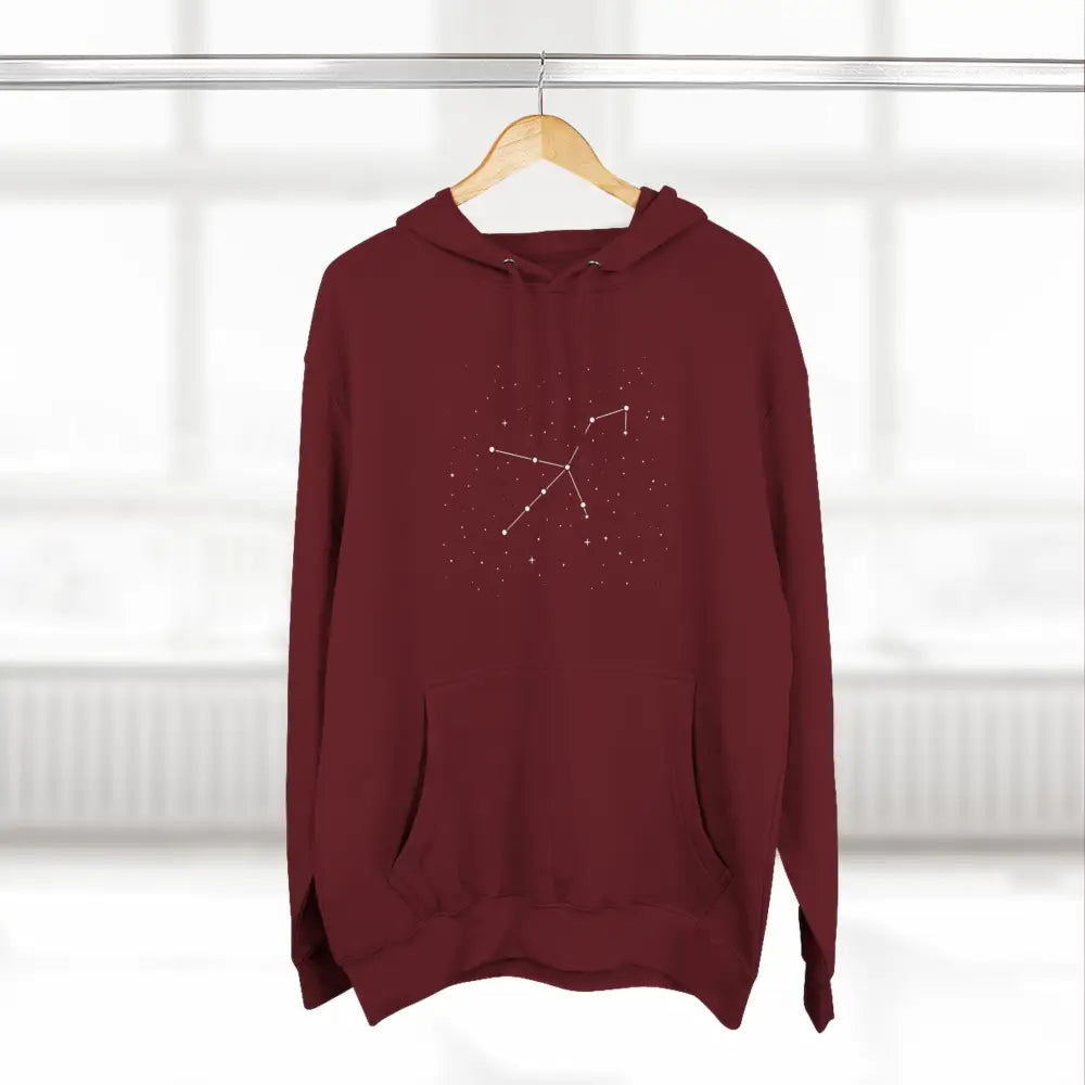 Maroon cozy fleece hoodie with white constellation design, adjustable hood, and spacious kangaroo pocket