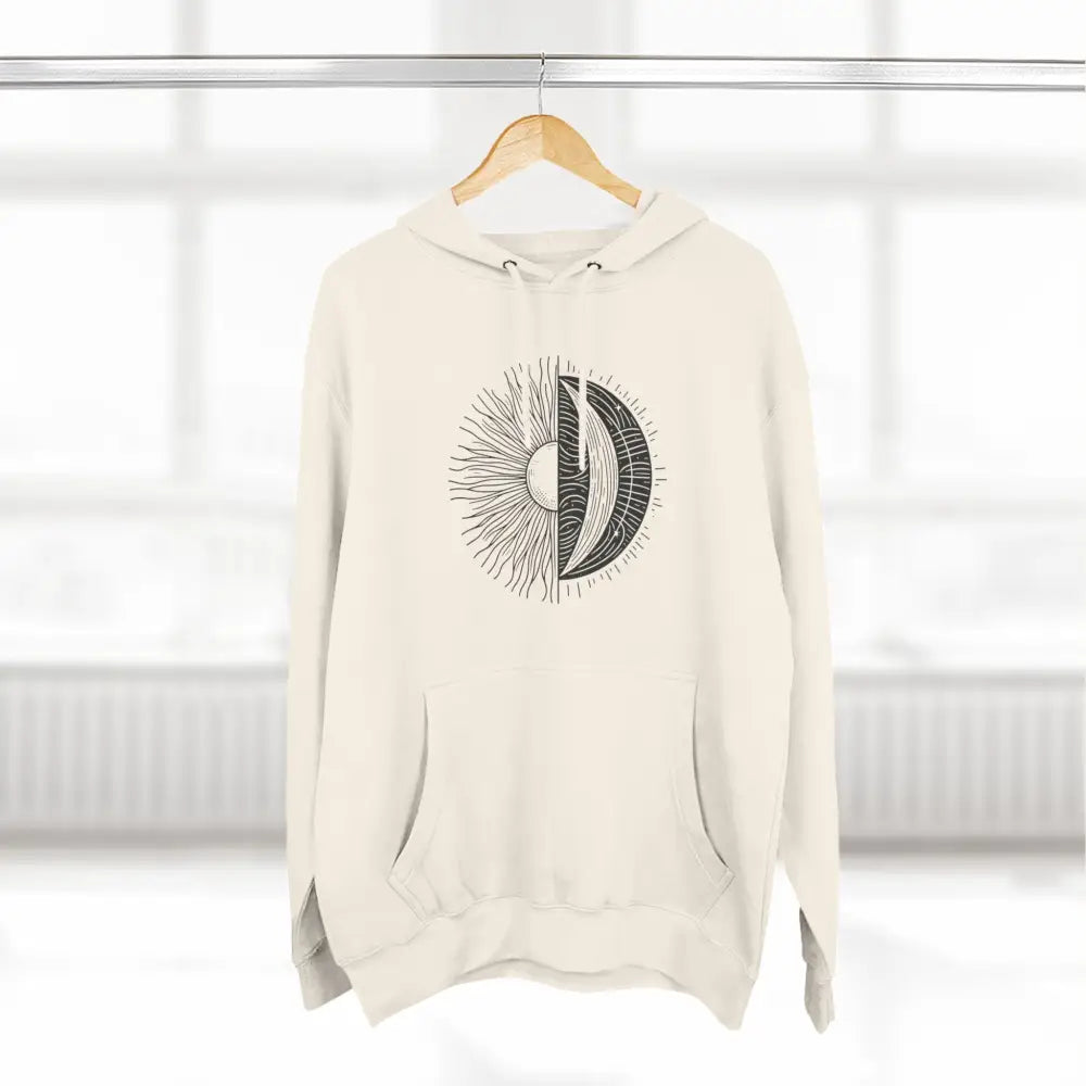 Cream-colored celestial hoodie with sun and moon graphic, cozy fleece with spacious kangaroo pocket