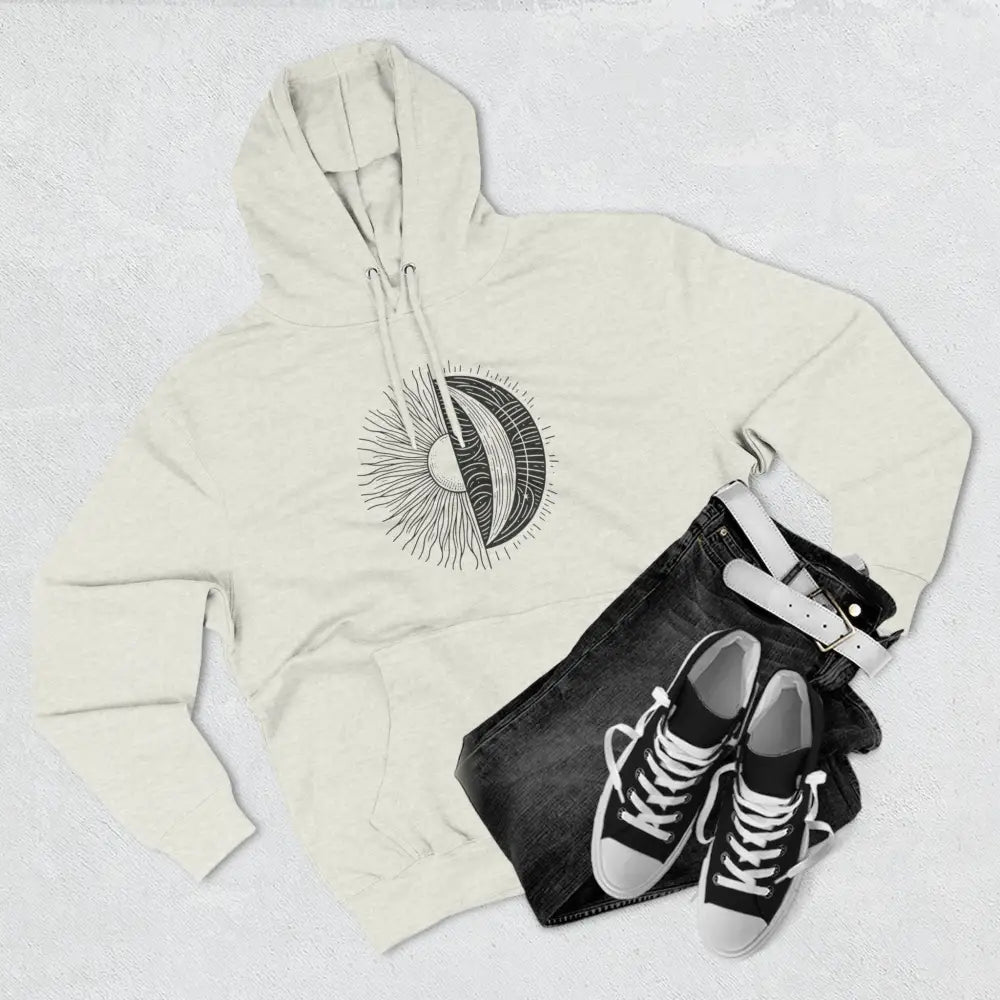 Cream-colored celestial hoodie with sun and moon graphic, cozy fleece with spacious kangaroo pocket