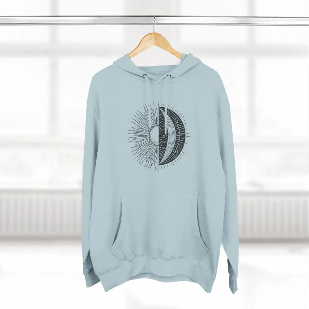 Light blue celestial hoodie with sun and moon graphic, cozy fleece, spacious pocket, twill tape neck