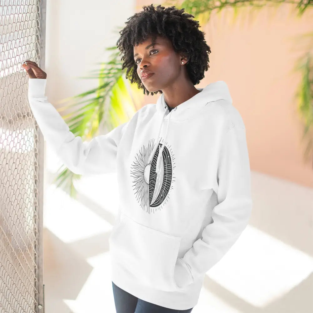 Woman wearing celestial sun and moon graphic cozy fleece hoodie with spacious kangaroo pocket