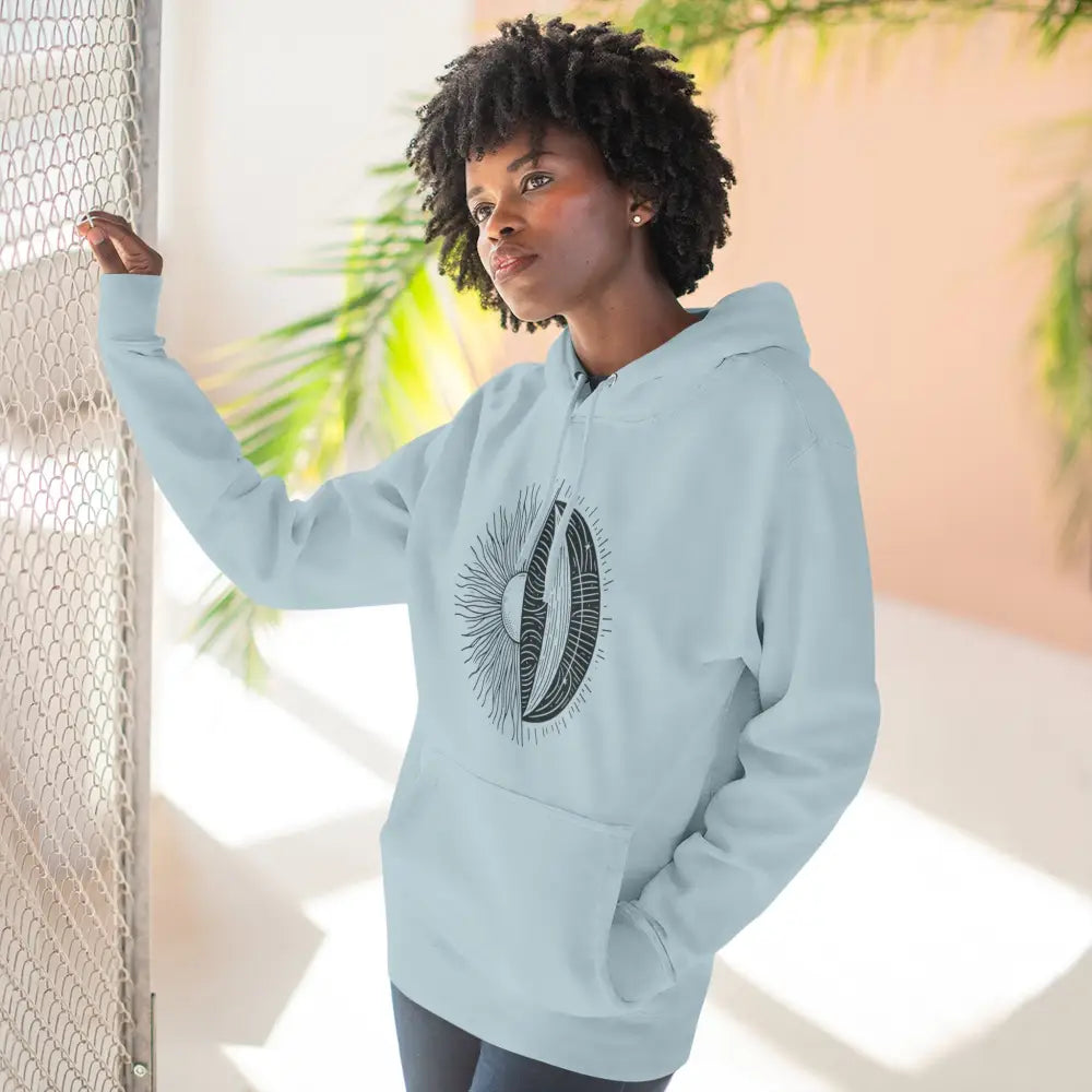 Light blue Celestial Harmony unisex hoodie with sun and moon graphic, cozy fleece, spacious kangaroo pocket