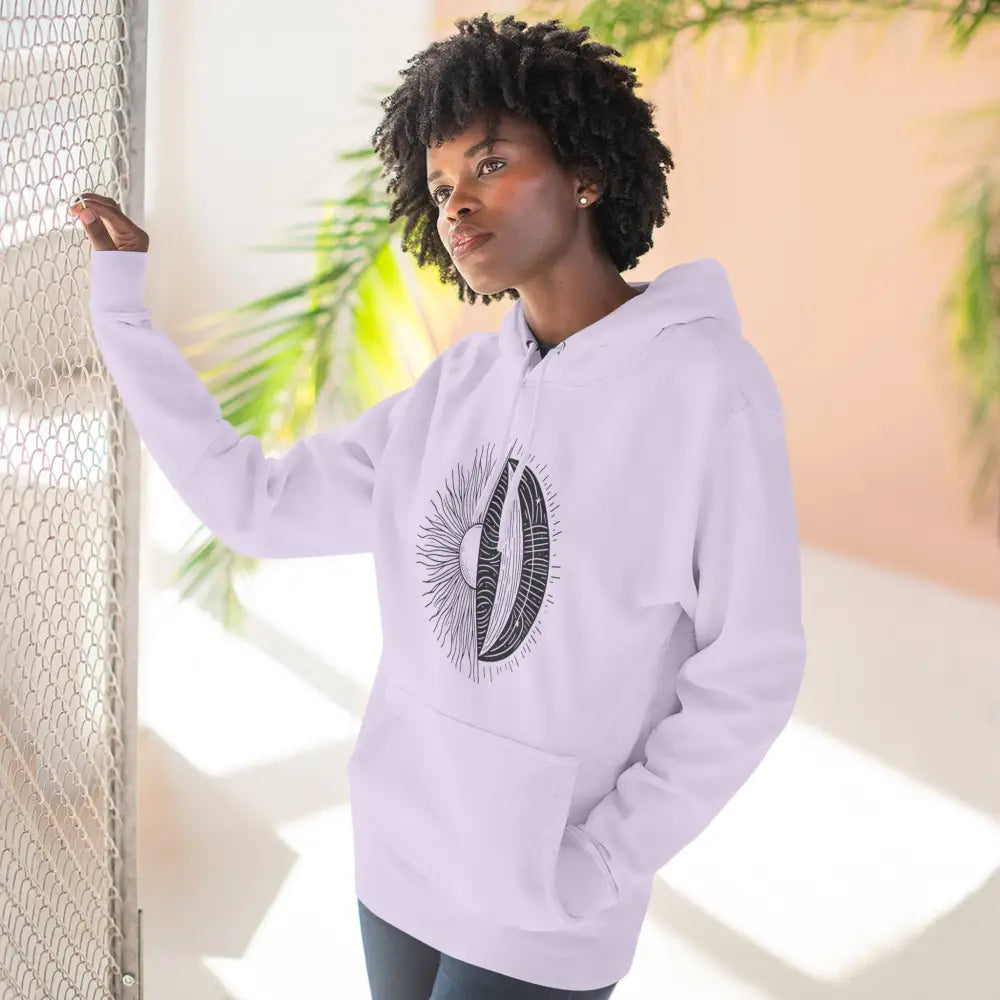 Woman wearing white celestial hoodie with sun and moon graphic, cozy fleece with kangaroo pocket