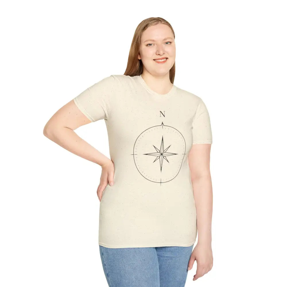 Woman wearing a cream compass graphic unisex T-shirt made of ring-spun cotton for outdoor activities