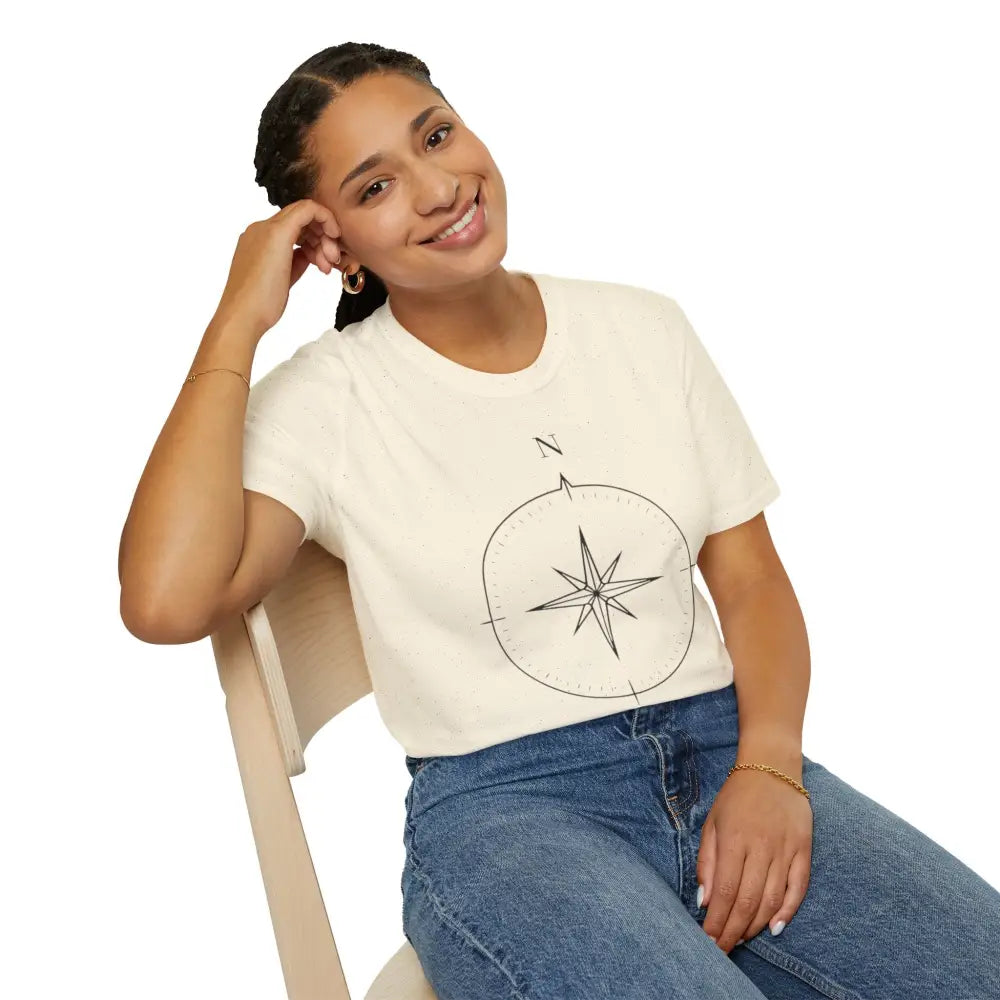 Woman wearing a cream-colored Compass Graphic Unisex T-Shirt with ring-spun cotton for outdoor activities