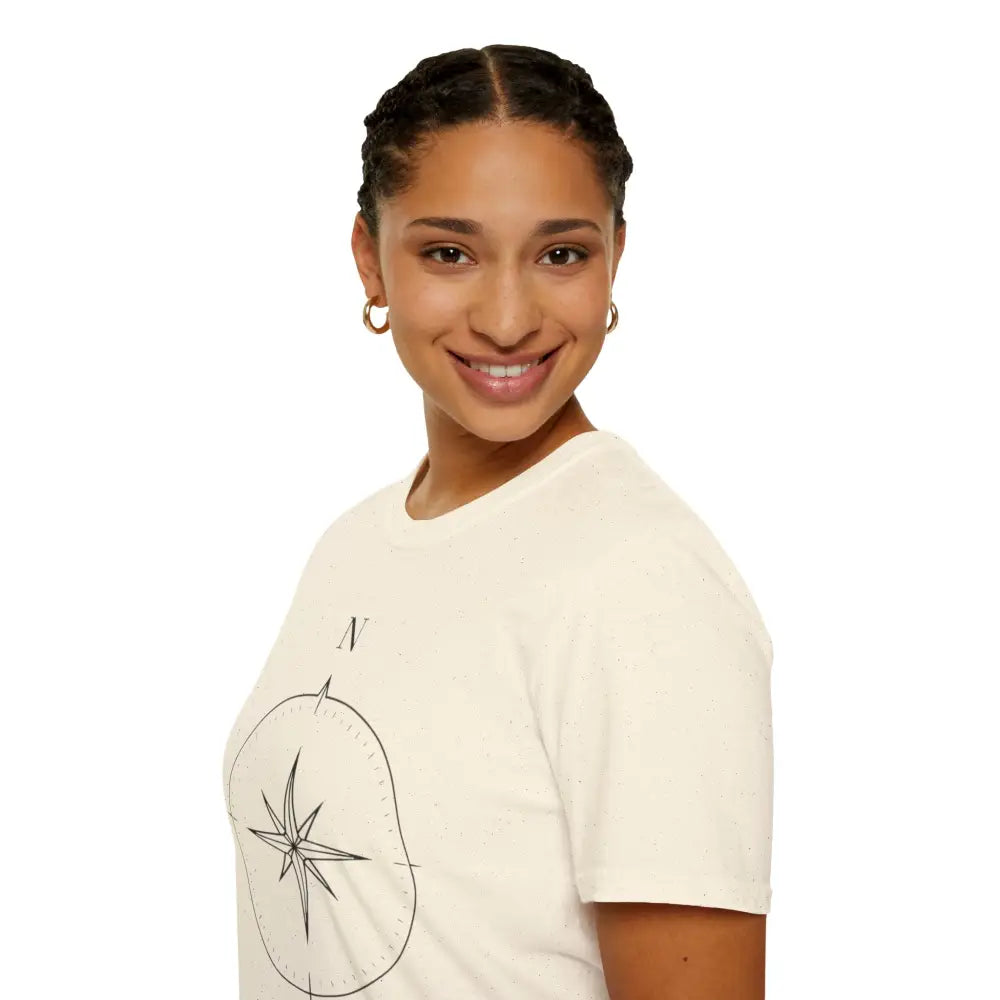 Smiling woman in cream-colored compass graphic unisex T-shirt made of ring-spun cotton for outdoor activities