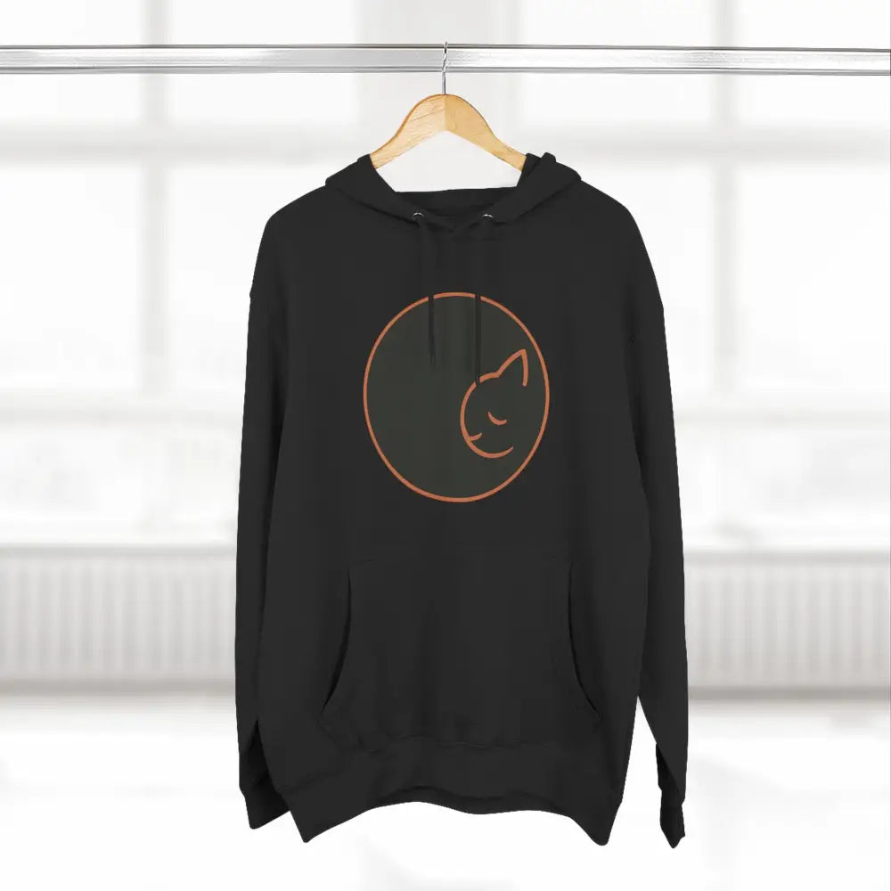 Black fleece hoodie with sleeping cat circle design, soft fabric, perfect for cozy wear