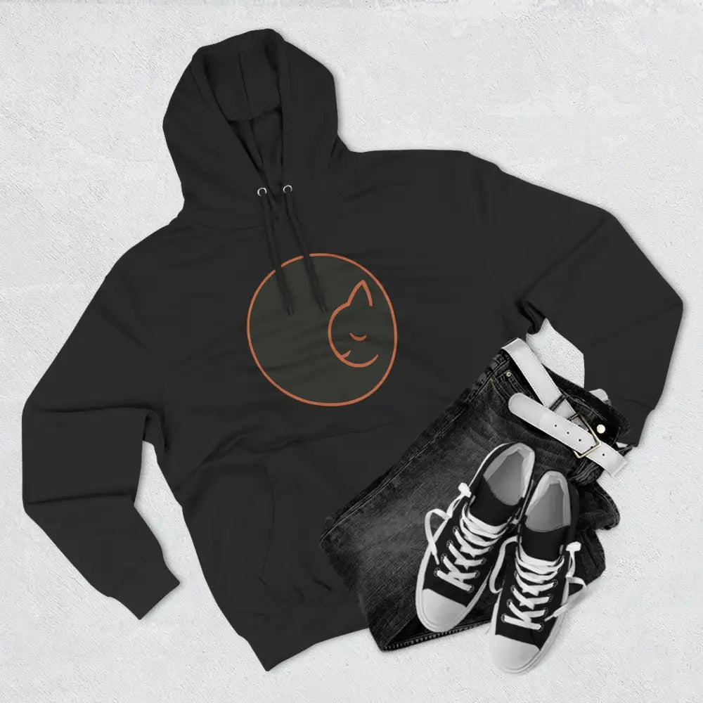 Black fleece hoodie with sleeping cat outline, soft fabric, perfect for cozy wear and gifts
